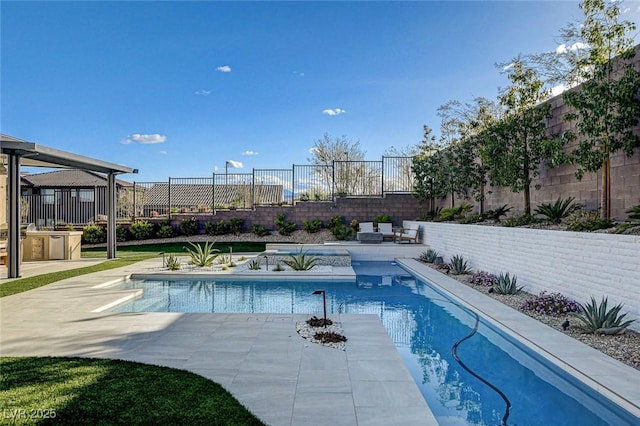 12199 Canyon Sunset St, Las Vegas, NV 89138 - view of swimming pool featuring a patio, a fenced backyard, and a fenced in pool