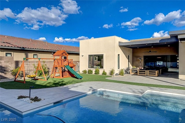 12199 Canyon Sunset St, Las Vegas, NV 89138 - back of house with a fenced in pool, stucco siding, a patio area, a playground, and a lawn