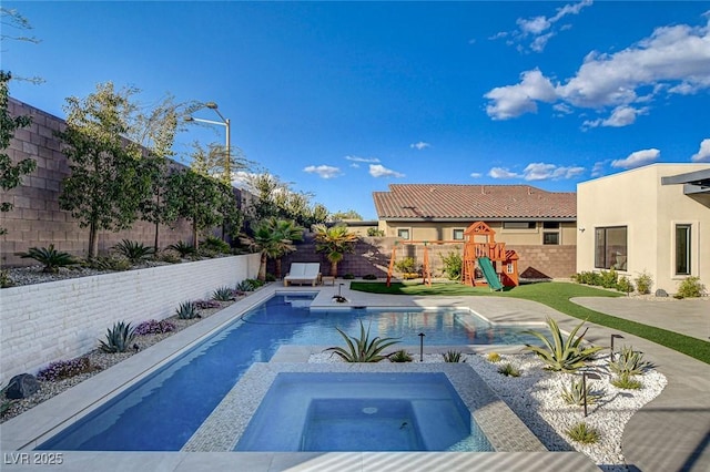 12199 Canyon Sunset St, Las Vegas, NV 89138 - view of swimming pool featuring a patio area, a fenced backyard, a playground, an in ground hot tub, and a fenced in pool