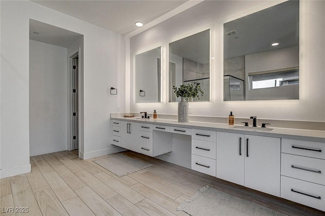 12199 Canyon Sunset St, Las Vegas, NV 89138 - full bath featuring a sink, baseboards, double vanity, and wood finished floors