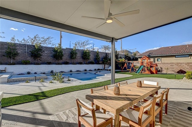 12199 Canyon Sunset St, Las Vegas, NV 89138 - view of patio featuring ceiling fan, a fenced backyard, a playground, a fenced in pool, and outdoor dining area