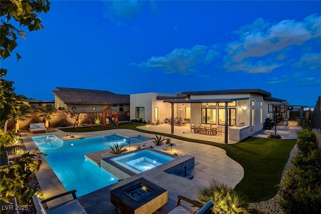 12199 Canyon Sunset St, Las Vegas, NV 89138 - view of swimming pool with a patio area, fence, a playground, an in ground hot tub, and a fenced in pool