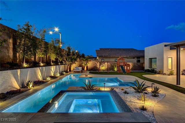 12199 Canyon Sunset St, Las Vegas, NV 89138 - view of pool with a fenced backyard, a patio, a playground, an in ground hot tub, and a fenced in pool