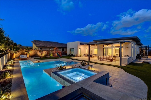 12199 Canyon Sunset St, Las Vegas, NV 89138 - view of swimming pool featuring a fenced backyard, a playground, a patio, an in ground hot tub, and a fenced in pool