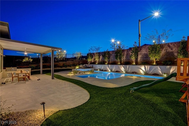 12199 Canyon Sunset St, Las Vegas, NV 89138 - view of pool with a patio, a fenced backyard, a fenced in pool, and a lawn