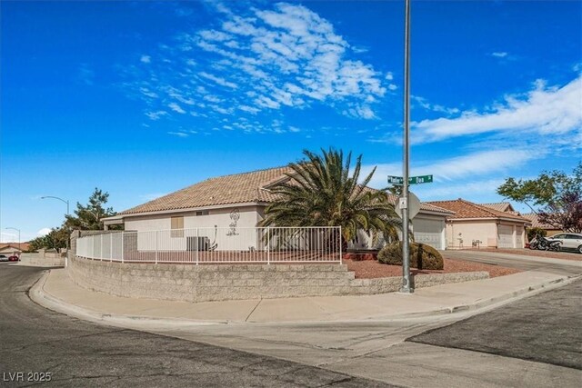 1066 Vanlier Ln, Henderson, NV 89015 - single story home featuring fence, stucco siding, a tile roof, and concrete driveway