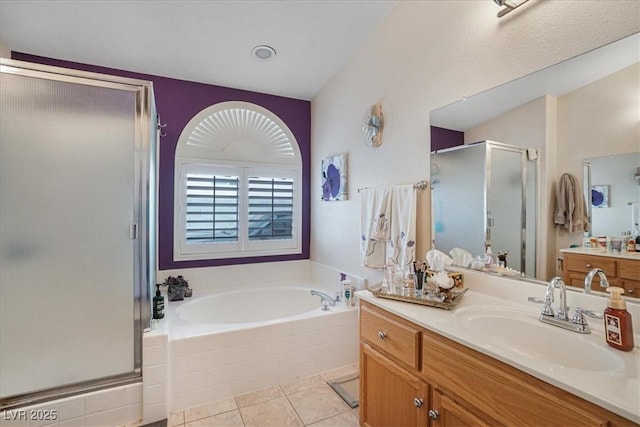 1066 Vanlier Ln, Henderson, NV 89015 - bathroom with a garden tub, a stall shower, vanity, and tile patterned flooring