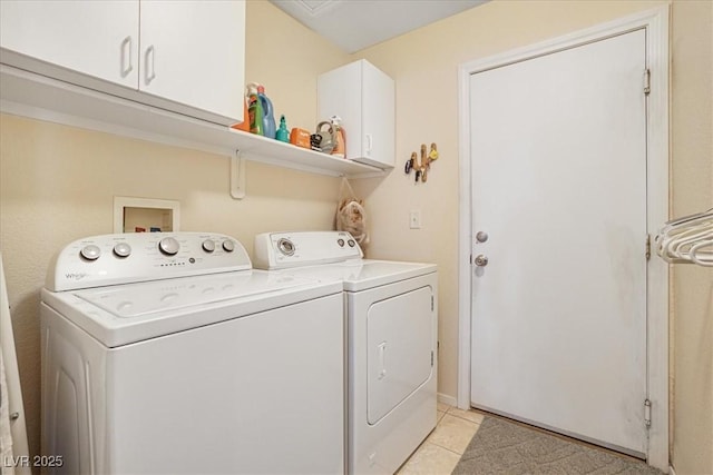 1066 Vanlier Ln, Henderson, NV 89015 - washroom with washing machine and clothes dryer, cabinet space, and light tile patterned floors