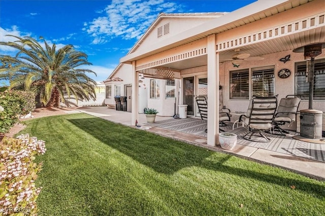 1066 Vanlier Ln, Henderson, NV 89015 - back of house with a ceiling fan, a yard, a patio area, and stucco siding
