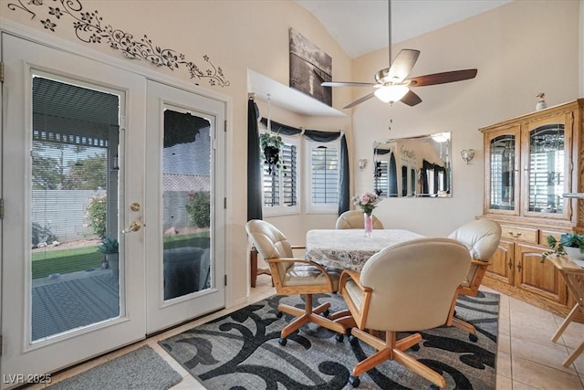 1066 Vanlier Ln, Henderson, NV 89015 - dining room featuring vaulted ceiling, healthy amount of natural light, a ceiling fan, and light tile patterned flooring