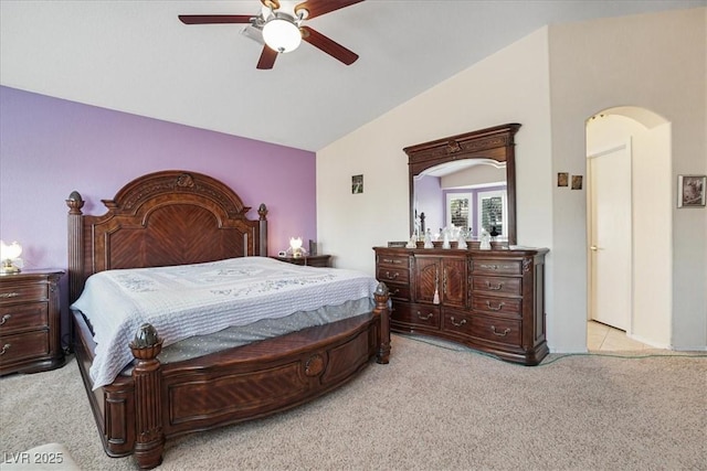 1066 Vanlier Ln, Henderson, NV 89015 - bedroom featuring carpet flooring, lofted ceiling, arched walkways, and ceiling fan