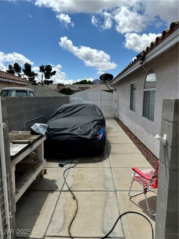 1066 Vanlier Ln, Henderson, NV 89015 - view of parking / parking lot featuring fence