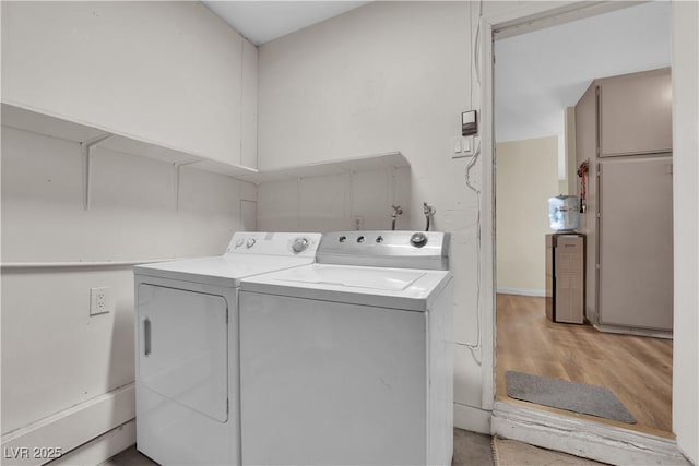 5530 Berchmans Ave, Las Vegas, NV 89122 - laundry room with light wood finished floors, independent washer and dryer, and laundry area