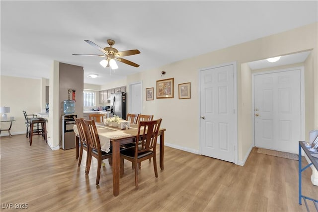 5530 Berchmans Ave, Las Vegas, NV 89122 - dining room with light wood-type flooring, baseboards, and ceiling fan