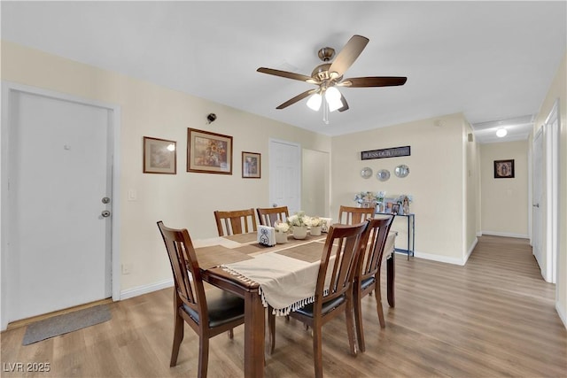 5530 Berchmans Ave, Las Vegas, NV 89122 - dining area featuring light wood-type flooring, baseboards, and ceiling fan