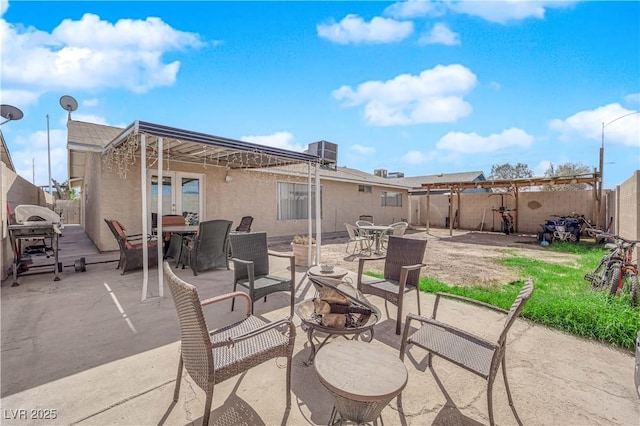 5530 Berchmans Ave, Las Vegas, NV 89122 - view of patio / terrace featuring french doors, a fenced backyard, outdoor dining area, grilling area, and cooling unit