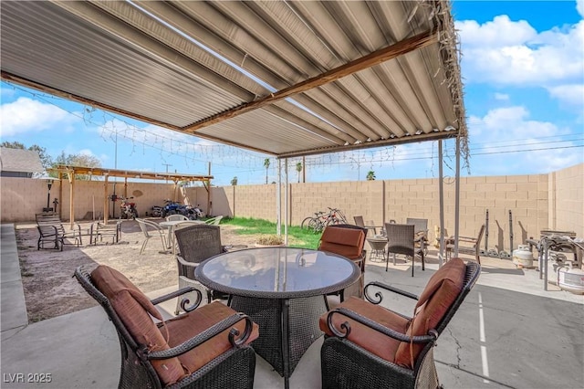 5530 Berchmans Ave, Las Vegas, NV 89122 - view of patio featuring a fenced backyard and outdoor dining area
