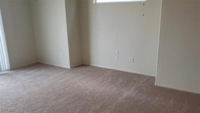 unfurnished room featuring carpet flooring