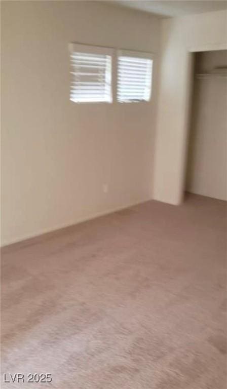 unfurnished bedroom with light colored carpet