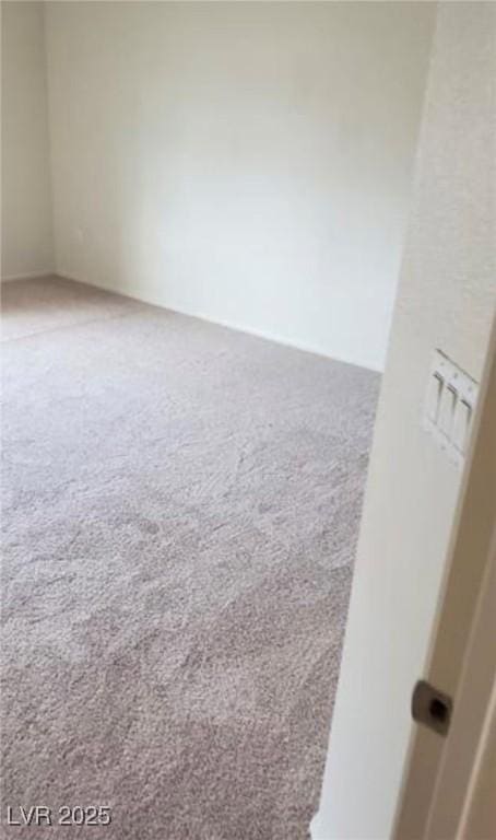 unfurnished room with carpet floors