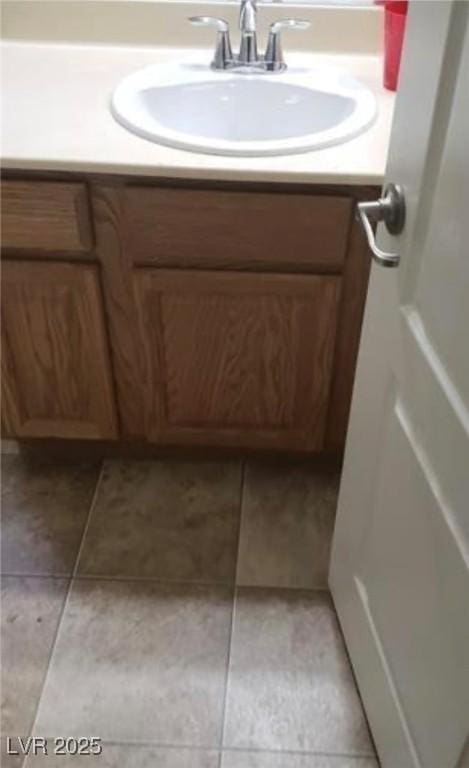 bathroom featuring tile patterned floors and vanity