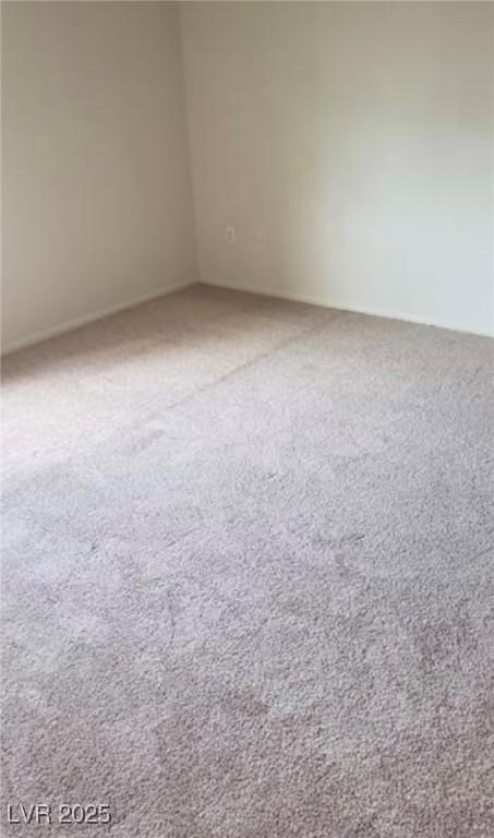 unfurnished room with carpet flooring