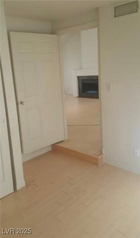 6974 Emerald Springs Ln, Las Vegas, NV 89113 - spare room with visible vents and light wood-type flooring