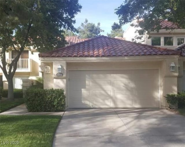 6974 Emerald Springs Ln, Las Vegas, NV 89113 - exterior space with a tiled roof, an attached garage, driveway, and stucco siding