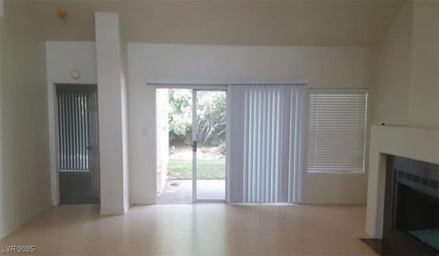 6974 Emerald Springs Ln, Las Vegas, NV 89113 - unfurnished living room with a fireplace with flush hearth