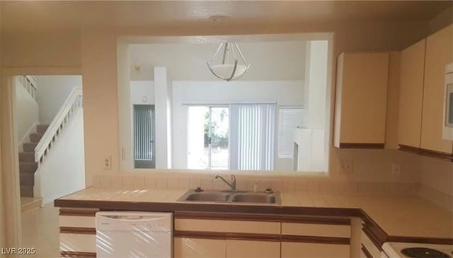 6974 Emerald Springs Ln, Las Vegas, NV 89113 - kitchen with a sink, light countertops, and white dishwasher