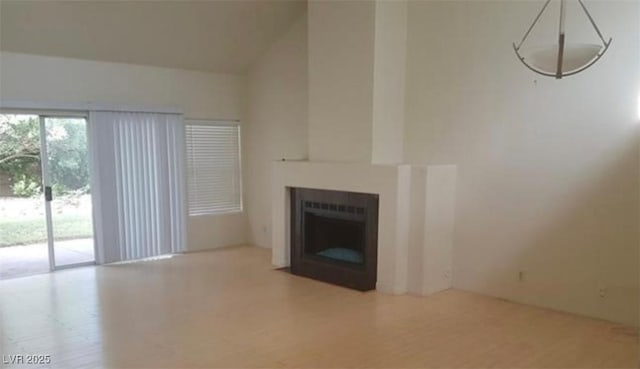 6974 Emerald Springs Ln, Las Vegas, NV 89113 - unfurnished living room with high vaulted ceiling and a fireplace
