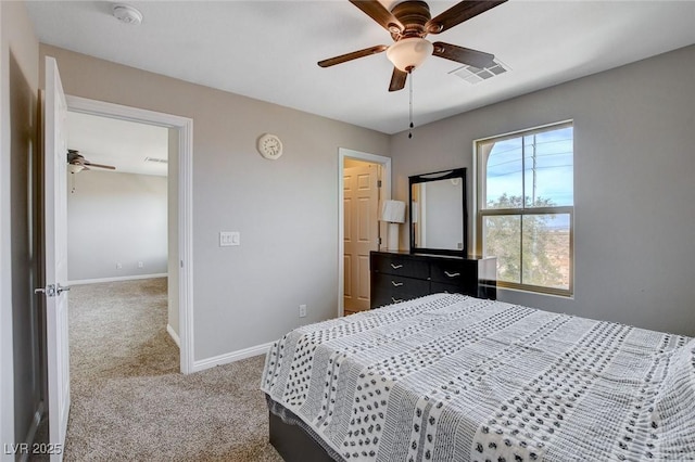 carpeted bedroom featuring baseboards and a ceiling fan