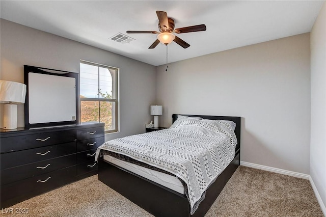 carpeted bedroom with baseboards and ceiling fan