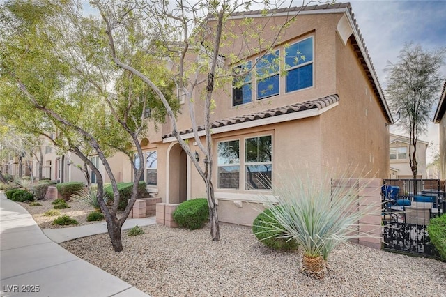 11036 Mount Hunter St, Las Vegas, NV 89179 - view of front of house featuring stucco siding and a tile roof