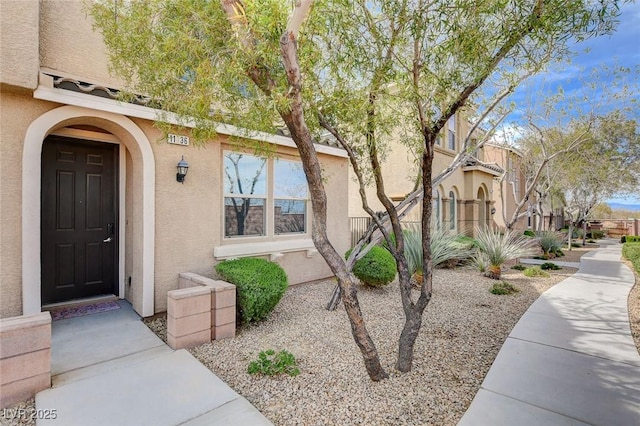 11036 Mount Hunter St, Las Vegas, NV 89179 - doorway to property featuring stucco siding