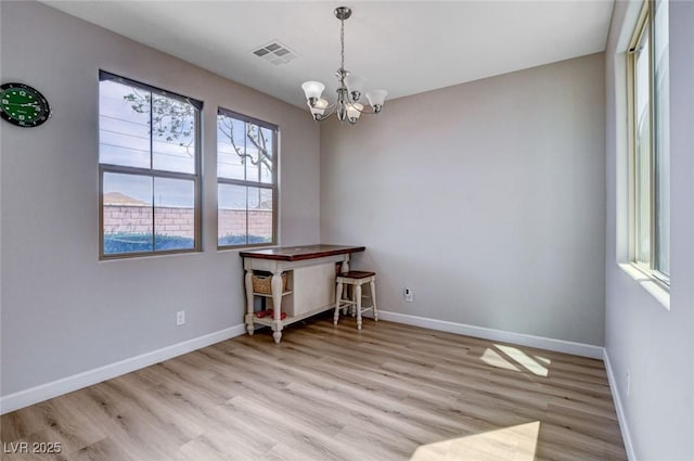11036 Mount Hunter St, Las Vegas, NV 89179 - unfurnished room with light wood-type flooring and a chandelier