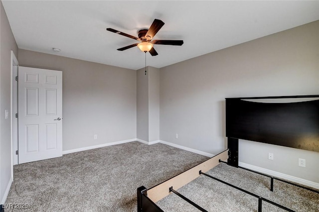 unfurnished bedroom featuring carpet, baseboards, and ceiling fan