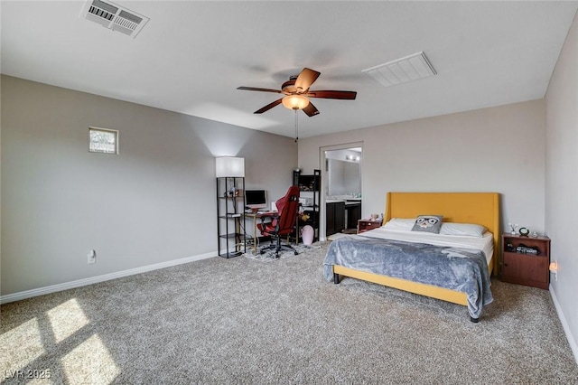 carpeted bedroom with a desk, baseboards, and a ceiling fan