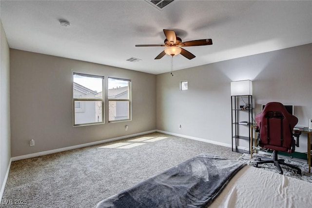 unfurnished bedroom featuring carpet flooring, baseboards, and a ceiling fan