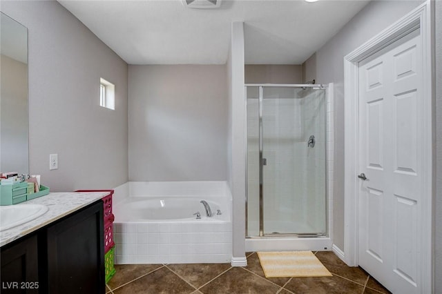 11036 Mount Hunter St, Las Vegas, NV 89179 - bathroom with vanity, a stall shower, a bath, and tile patterned floors