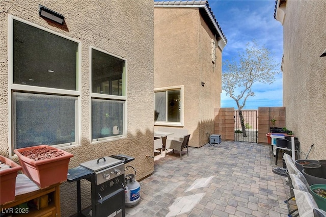 view of patio / terrace with a gate and fence
