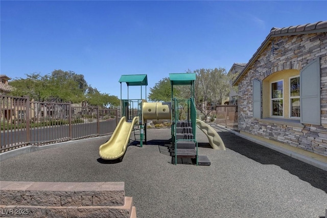 communal playground featuring fence
