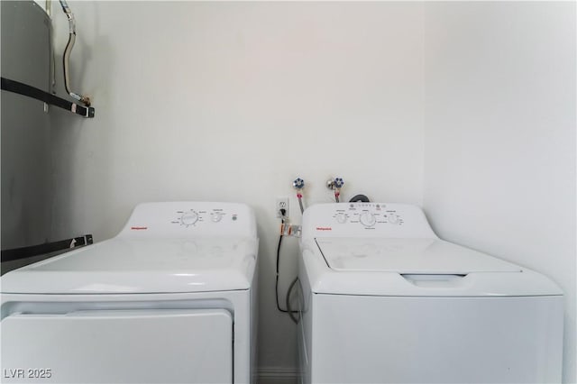 washroom featuring independent washer and dryer and laundry area