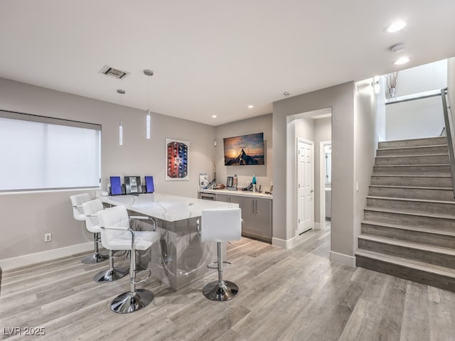 5 Clear Crossing Trl, Henderson, NV 89052 - dining space with wet bar, recessed lighting, light wood-style flooring, and stairway