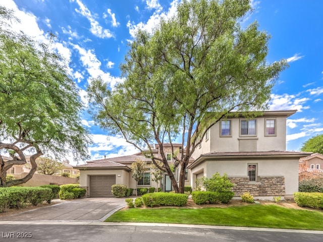 5 Clear Crossing Trl, Henderson, NV 89052 - view of front of property featuring stucco siding, stone siding, driveway, and an attached garage