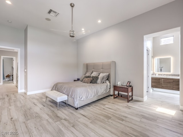 5 Clear Crossing Trl, Henderson, NV 89052 - bedroom with light wood finished floors, recessed lighting, and connected bathroom