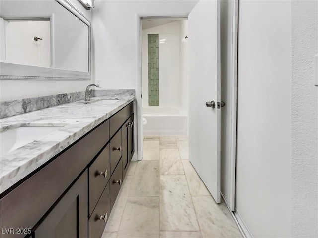 full bath with shower / bath combination, double vanity, and a sink