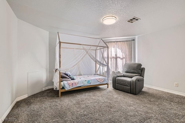 bedroom with visible vents, baseboards, carpet flooring, and a textured ceiling