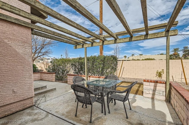 view of patio / terrace with a pergola, outdoor dining area, and a fenced backyard