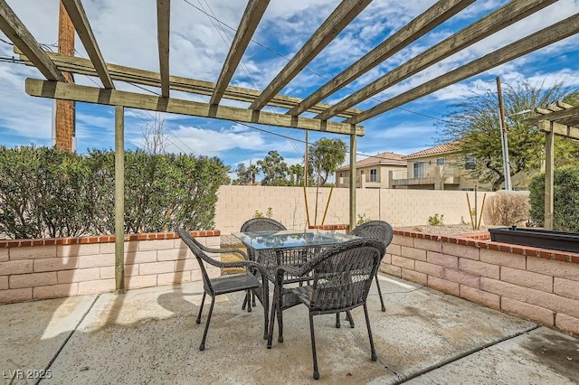view of patio / terrace featuring outdoor dining space, fence, and a pergola